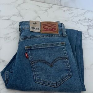 721 high rise skinny Levi's Light Blue Denim Jeans ripped on knee
